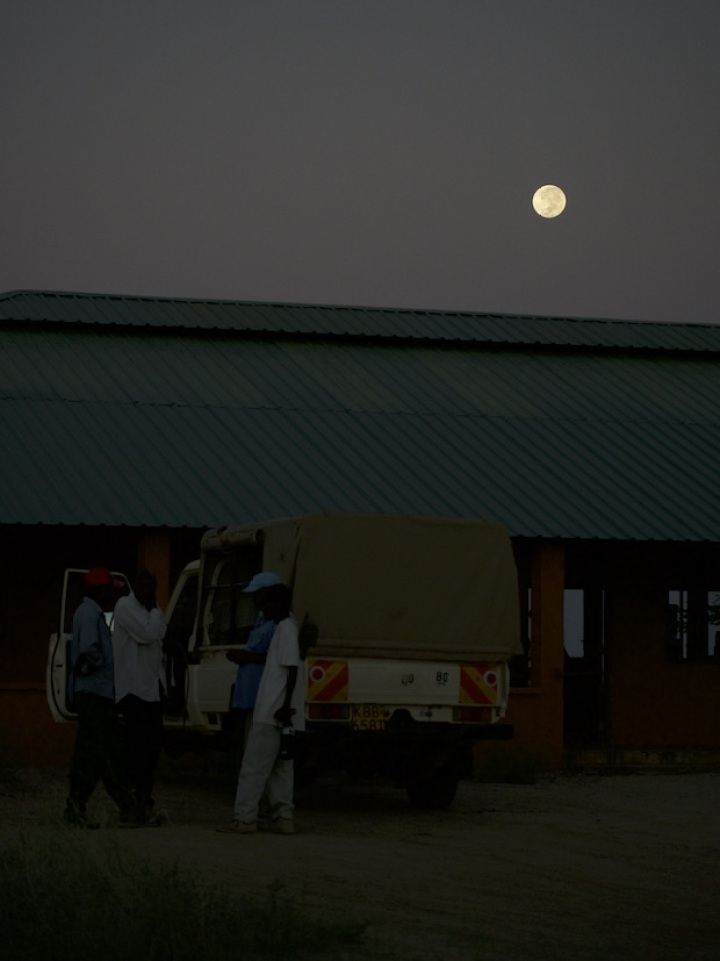 The team unpack the vehicle at the end of the day, with a 'Supermoon' hanging overhead